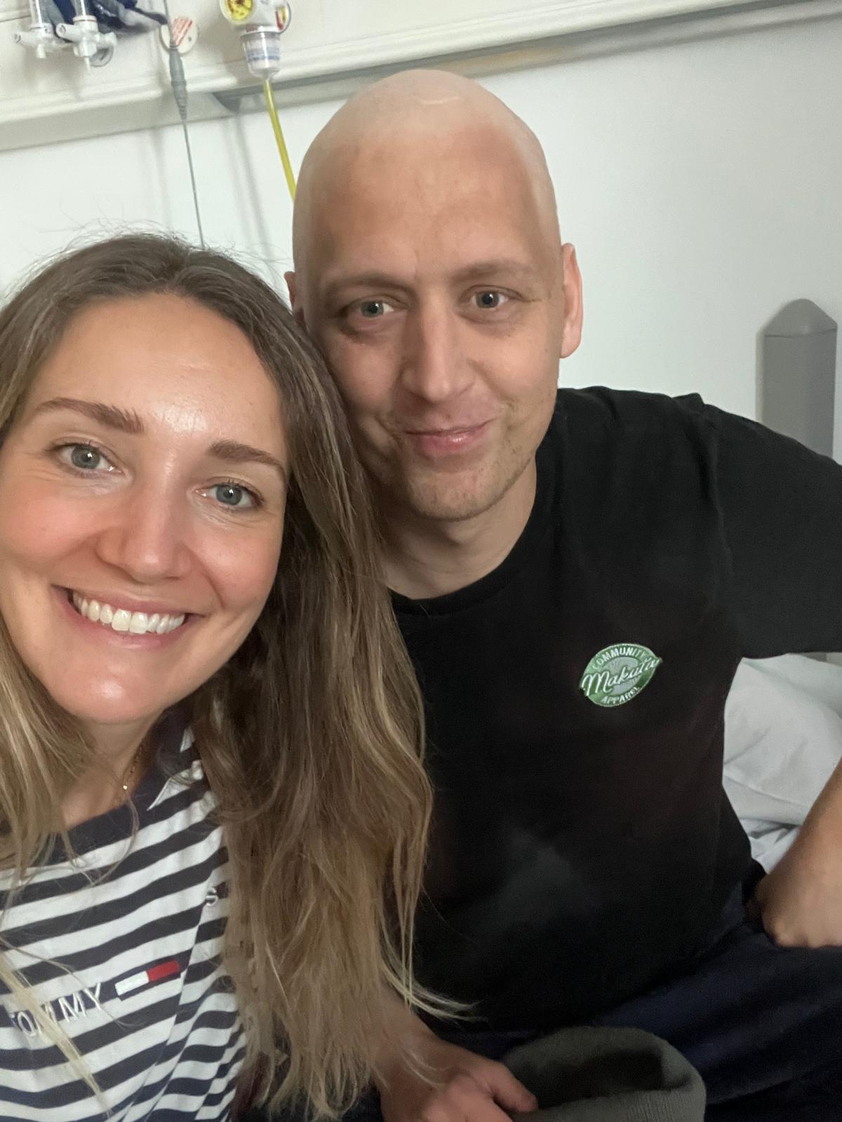 Tom and Bethan in hospital, moments after Tom finished his stem cell surgery